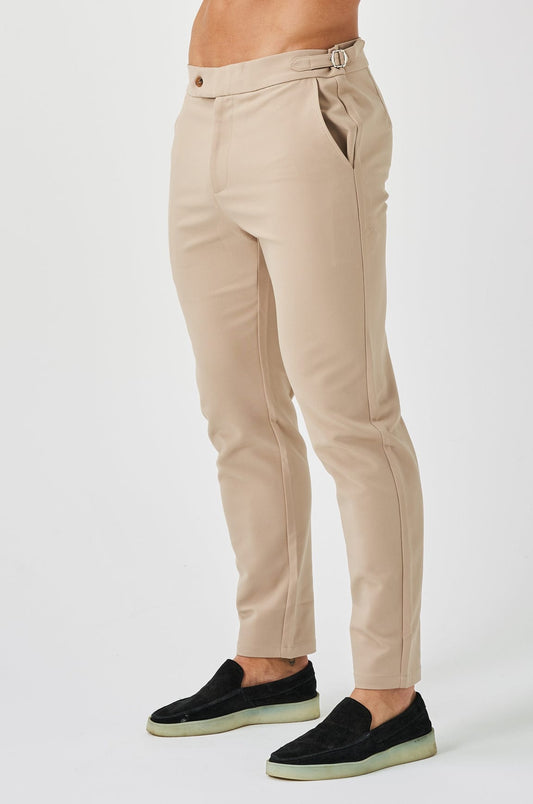 Elastiska byxor med platt tryck och sidohängslen – beige